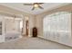 Spacious living room boasts neutral walls, plush carpeting, and natural light at 1585 Maidencane Loop, Oviedo, FL 32765