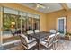 Outdoor patio area with dining table and chairs with a beautiful view of the pool area at 1585 Maidencane Loop, Oviedo, FL 32765