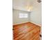 Cozy bedroom with wood floors, natural light, and a ceiling fan at 1603 Gaston Foster Rd, Orlando, FL 32812