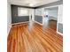 Bright and airy living room featuring hardwood floors, neutral paint, and open access to the kitchen at 1603 Gaston Foster Rd, Orlando, FL 32812