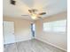 Comfortable main bedroom with vinyl flooring, neutral paint, and natural light at 1603 Gaston Foster Rd, Orlando, FL 32812