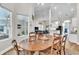 Open-concept dining room leads to the living room and kitchen, promoting seamless entertaining at 1610 River Birch Ave, Oviedo, FL 32765