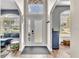 Inviting entryway featuring arched doorways and a transom window above the front door at 1610 River Birch Ave, Oviedo, FL 32765