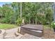 Backyard hot tub with brick paver patio, privacy landscaping, and a built-in barbeque at 1610 River Birch Ave, Oviedo, FL 32765