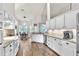 Chef's kitchen offers white cabinets, countertops and opens to the dining area at 1610 River Birch Ave, Oviedo, FL 32765