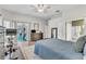 Spacious main bedroom with wood floors, ceiling fan, and sliding doors to outdoor living area at 1610 River Birch Ave, Oviedo, FL 32765