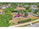 Community playground with colorful play structures, surrounded by lush greenery and residential homes at 1610 River Birch Ave, Oviedo, FL 32765