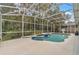 Screened-in pool with water features, plenty of room, and a view of the verdant backyard at 1610 River Birch Ave, Oviedo, FL 32765