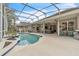 Sparkling pool is surrounded by a screened enclosure, ensuring privacy and extending the outdoor living season at 1610 River Birch Ave, Oviedo, FL 32765