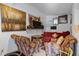 Basement featuring exposed painted block, bright art, and a red sofa at 1828 Matterhorn Dr, Orlando, FL 32818