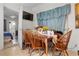 Dining room features a wooden table, tile floors, and natural light at 1828 Matterhorn Dr, Orlando, FL 32818
