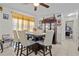 Bright dining room featuring neutral tile floors, modern light fixture, and ample natural light at 1828 Matterhorn Dr, Orlando, FL 32818