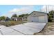 Single-story home with an attached garage and a concrete driveway at 1828 Matterhorn Dr, Orlando, FL 32818