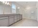 Bathroom features double granite vanity and glass shower at 18964 Rawson St, Orlando, FL 32827