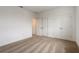 Cozy bedroom featuring neutral carpeting and access to an adjacent room at 18964 Rawson St, Orlando, FL 32827