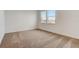 A carpeted bedroom is bathed in light from dual windows, offering a bright and airy space at 18964 Rawson St, Orlando, FL 32827
