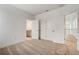 Bright bedroom featuring neutral carpet, closet, and an ensuite bathroom with a granite vanity at 18964 Rawson St, Orlando, FL 32827