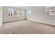 Bright bedroom featuring multiple windows and neutral carpet at 18964 Rawson St, Orlando, FL 32827