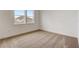 Bright bedroom with neutral carpet, a window view, and ample natural light at 18964 Rawson St, Orlando, FL 32827