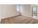 Bedroom with neutral carpet, natural light, and a glimpse of the neighborhood at 18964 Rawson St, Orlando, FL 32827