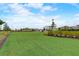 Large, well-manicured community lawn area perfect for recreation and outdoor activities at 18964 Rawson St, Orlando, FL 32827