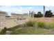 Stone community entrance sign for Summerdale Park set amongst landscaped beds and native grasses at 18964 Rawson St, Orlando, FL 32827