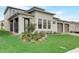 Lovely modern home showcasing its well-manicured front yard, stylish exterior, and welcoming entrance at 18964 Rawson St, Orlando, FL 32827
