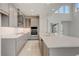 Stylish kitchen featuring an island with seating, stainless appliances, and modern finishes at 18964 Rawson St, Orlando, FL 32827