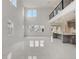 Open floor plan featuring the living room, kitchen, and upstairs landing at 18964 Rawson St, Orlando, FL 32827