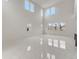 Bright living room with high ceilings and many windows overlooking the yard at 18964 Rawson St, Orlando, FL 32827