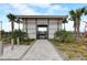 Welcoming pool entrance with shade and manicured landscaping with an address clearly displayed at 18964 Rawson St, Orlando, FL 32827
