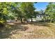 Backyard with mature trees offering plenty of shade at 2014 10Th Nw St, Winter Haven, FL 33881