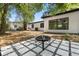 Backyard featuring a cozy seating area with a fire pit, ideal for outdoor entertaining at 2014 10Th Nw St, Winter Haven, FL 33881