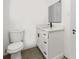 Bathroom featuring a modern vanity with sleek black hardware and new toilet at 2014 10Th Nw St, Winter Haven, FL 33881