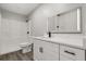 Modern bathroom with a white vanity, black fixtures, and a combined shower and tub, designed for comfort at 2014 10Th Nw St, Winter Haven, FL 33881