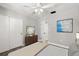 Bright bedroom with hardwood floors, a closet and modern paintings creating a serene and stylish retreat at 2014 10Th Nw St, Winter Haven, FL 33881