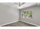Bedroom with a ceiling fan and a view of the outdoors at 2014 10Th Nw St, Winter Haven, FL 33881