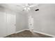 Bedroom features updated floors, ceiling fan, and a closet at 2014 10Th Nw St, Winter Haven, FL 33881