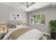 A cozy bedroom with a queen size bed, lots of pillows and big windows providing natural light at 2014 10Th Nw St, Winter Haven, FL 33881
