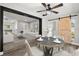 Bright dining room with hardwood floors, modern table, and an open view into the adjacent living room at 2014 10Th Nw St, Winter Haven, FL 33881