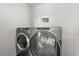 Laundry machines in a small laundry space at 2014 10Th Nw St, Winter Haven, FL 33881