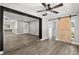 This is a spacious living room with neutral walls and hardwood floors for a cozy yet modern appeal at 2014 10Th Nw St, Winter Haven, FL 33881