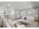 Inviting living room with modern furniture, neutral colors, and an open layout, ideal for relaxation and entertaining at 2014 10Th Nw St, Winter Haven, FL 33881