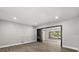 Spacious living room with an electric fireplace and a large window at 2014 10Th Nw St, Winter Haven, FL 33881