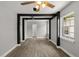 Open living room area with gray walls, ceiling fan, and wood-look flooring at 2014 10Th Nw St, Winter Haven, FL 33881