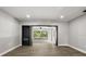 Bright living room boasts an electric fireplace and wood-look vinyl flooring at 2014 10Th Nw St, Winter Haven, FL 33881