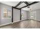 Living room with large windows and wood-look flooring at 2014 10Th Nw St, Winter Haven, FL 33881