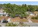 Charming single-story home with a mature shade tree, driveway, and a well-maintained lawn at 2014 10Th Nw St, Winter Haven, FL 33881