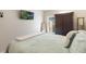 Bedroom featuring wood look flooring, a window, and a TV on the wall at 2098 Carpathian Dr, Apopka, FL 32712