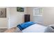 Bright bedroom with a mounted television, dresser, and comfortable bedding creating a relaxed, inviting space at 2098 Carpathian Dr, Apopka, FL 32712